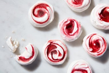 Meringues swirled with cranberry curd and lime